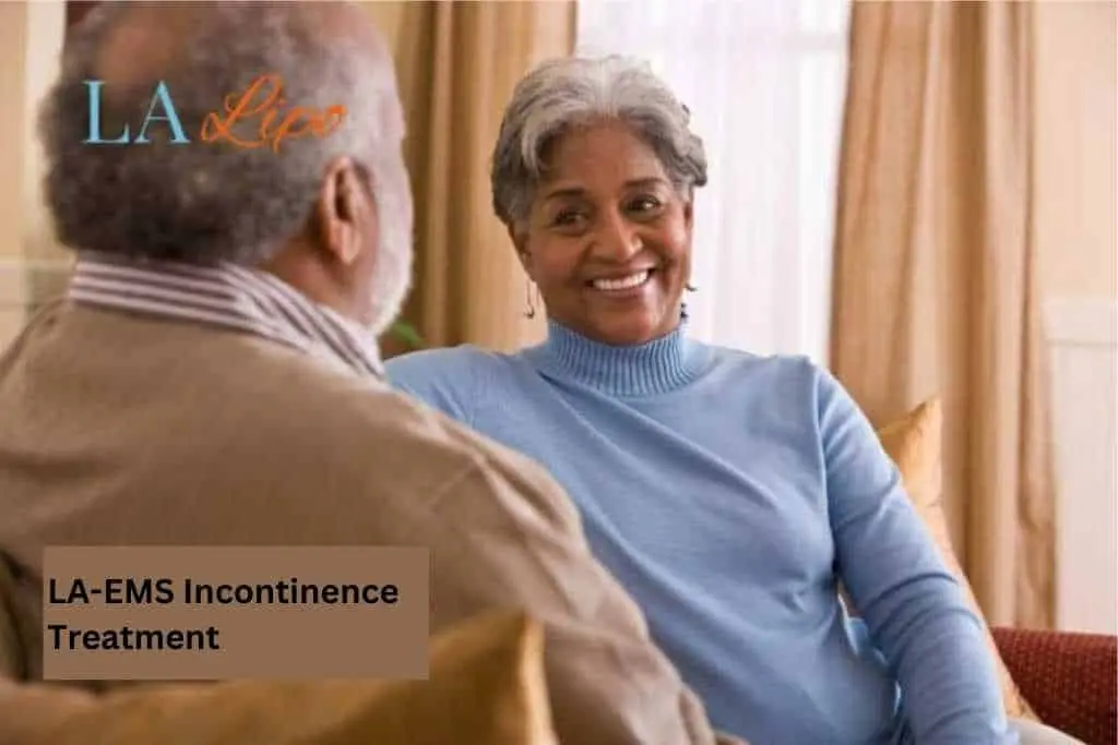 Couple sat smiling at each other - LA-EMS treatment Brentford